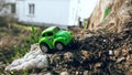 Small green car with rubber wheels, metal body, toy for children. Royalty Free Stock Photo