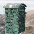A small green lifeguard telephone box in La Jolla Cove