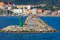 Small green lighthouse at entrance to Carloforte harbor at San Pietro island, Sardinia Royalty Free Stock Photo