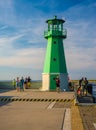Small green lighthouse in Gdansk harbor