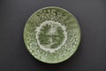 Small green plate of an old english porcelain with a rural scene. Retro tableware Royalty Free Stock Photo
