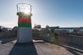 Small green, red and white coastal lighthouse