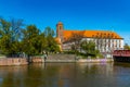 Small green square in Piasek island with Roman Catholic Church of St. Blessed Virgin Mary at Royalty Free Stock Photo