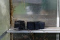 A small greenhouse needs a clean to get ready for Spring, it`s pots are covered in spiders` webs as it has sat empty through Royalty Free Stock Photo