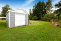 Small grey shed with white trim. Countryside real estate