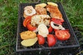 Small Grill, Barbecue, Bbq with Smoke, Mini Barbecue with Grilled Meat and Vegetables Royalty Free Stock Photo