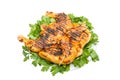 Small grilled chicken on a white dish