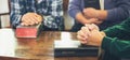 Small group of asian people praying worship believe. Teams of friends worship together before studying Holy bible. family praying Royalty Free Stock Photo