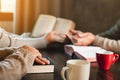 Small group of asian people praying worship believe. Teams of friends worship together before studying Holy bible. family praying Royalty Free Stock Photo