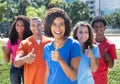 Small group of happy young man and woman showing thumb up Royalty Free Stock Photo