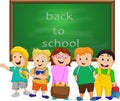 A Small Group of Kids school boy standing in front of chalkboard