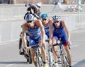 Small group of male cycling triathlon competitors fighting Royalty Free Stock Photo