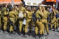 A small group of off duty female Israeli Army conscripts with an armed guard laugh and chat together at the Mahane Yehuda street m