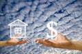 Small hand exchange the house with money Royalty Free Stock Photo