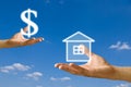 Small hand exchange the house with money from big Royalty Free Stock Photo