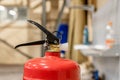 Small hand-held fire extinguisher with pressure gauge in a locksmith`s shop Royalty Free Stock Photo