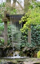 The small handmade waterfall in the green garden