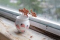 Small handmade white clay pot for making wishes or flowers from boutonnieres. Decor engobe, covered with transparent glaze, two