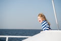 Small happy baby boy captain of yacht in marine shirt Royalty Free Stock Photo