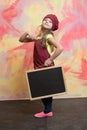 Small happy girl chef in hat, apron with blackboard Royalty Free Stock Photo