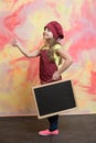 Small happy girl chef in hat, apron with blackboard Royalty Free Stock Photo