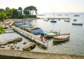 Small harbor with beach with privately owned small colorful boats in Antibes, French Riviera