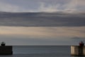 Small harbor entrance for boats, calm blue sea