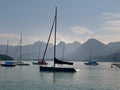 Small harbor in Wolfgangsee mountain lake. Anchored yachts, sunny weather. Royalty Free Stock Photo