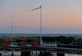 a small harbour with boats and tiny houses in the evening in Boderne, Bornholm, Denmark