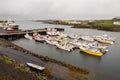 A small harbour in a city of Djupivogur, Iceland with a lot of small ships