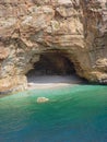 Small and hardly accessible beach with a grotto