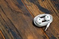 Small headphones for mobile phone on wooden background