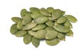 Small heap of green pumpkin seed isolated on white background