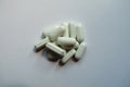 Small heap of white caplets of kelp dietary supplement