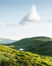 Small heart-shaped mountain lake on green slopes c Royalty Free Stock Photo