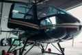 Small helicopter in hangar, private airline copter