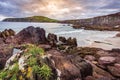 Small, hidden beach with view on Dingle bay and lighthouse in Co. Kerry, Ireland Royalty Free Stock Photo