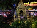 Small Hindu sanctuary on the street of an Asian city, night time