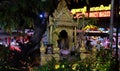 Small Hindu sanctuary on the street of an Asian city, night time