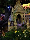 Small Hindu sanctuary on the street of an Asian city, night time