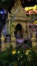 Small Hindu sanctuary on the street of an Asian city, night time