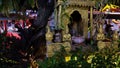 Small Hindu sanctuary on the street of an Asian city, night time