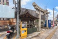 Small hokora shrine called Ebisu Jinja with a torii gate along the Nakashima river in Nagasaki. Royalty Free Stock Photo