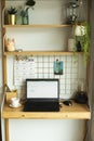 Small home office area with laptop desk and decorations Royalty Free Stock Photo