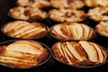 Small homemade apple pies freshly baked each in its mold Royalty Free Stock Photo