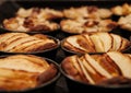 Small homemade apple pies freshly baked each in its mold Royalty Free Stock Photo