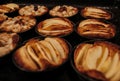 Small homemade apple pies freshly baked each in its mold Royalty Free Stock Photo