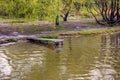 Small homemade river pier for boat and fishing