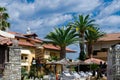 small hotel-villa with palm trees in Greek style Royalty Free Stock Photo