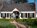 Small house and brick trail Royalty Free Stock Photo